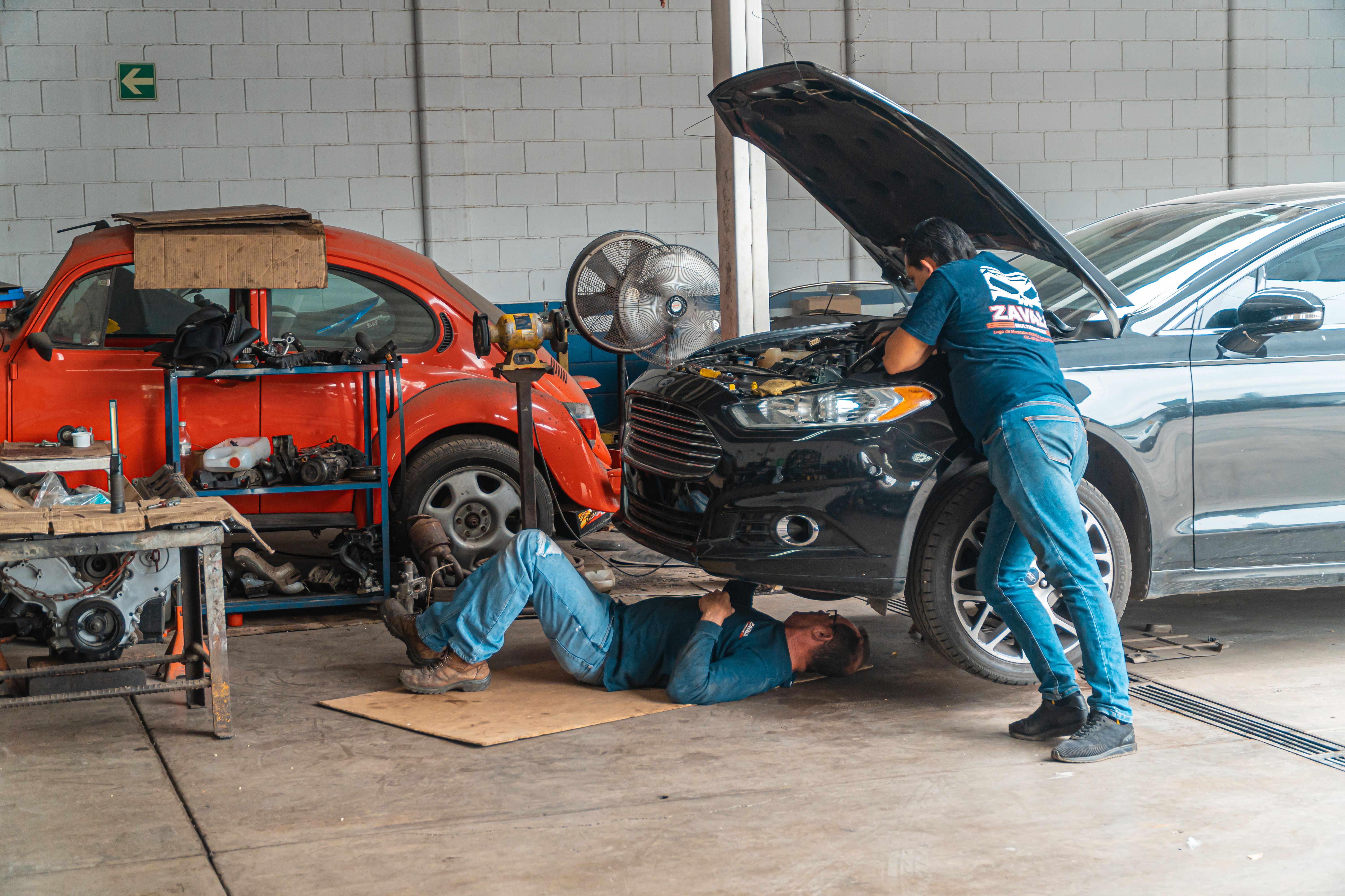 Auto body technician working on vehicle repair
